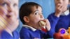 Child eating sandwich, back to school marketing targeted his parents