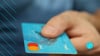 Credit card in someones hand after they have been targeted by targeted credit card marketing