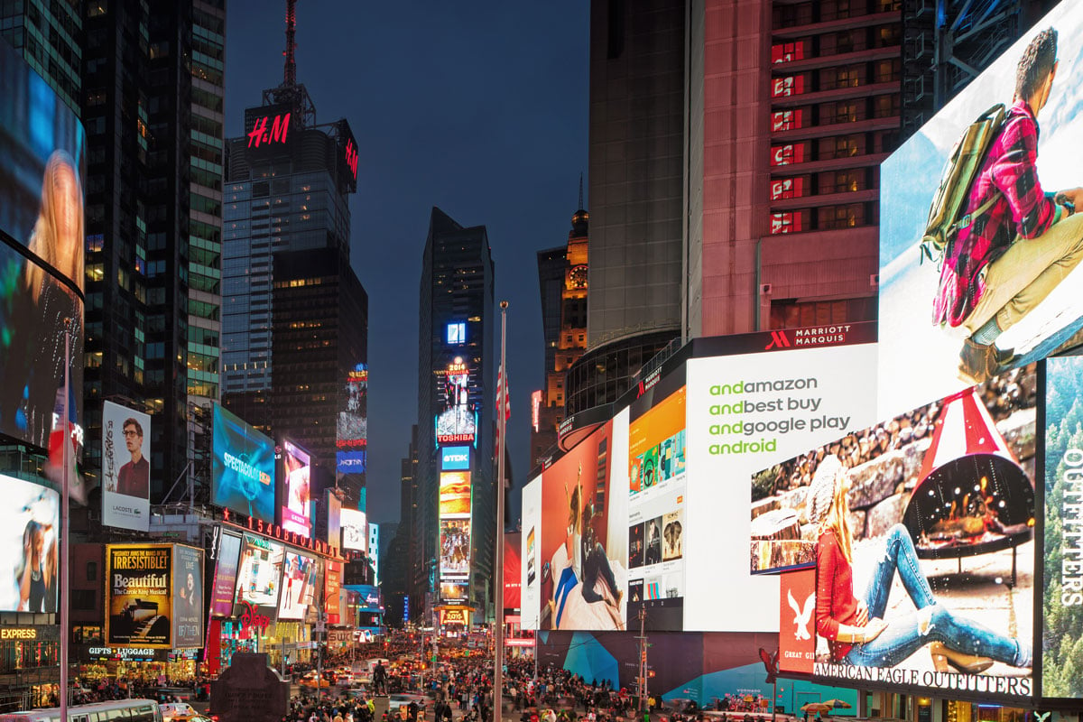 A photo of DOOH ad displays in Times Square, NY.